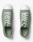 The shoe is a pair of "Nothing" shoes from Wellington in green color and with a sponge gift for every new order.